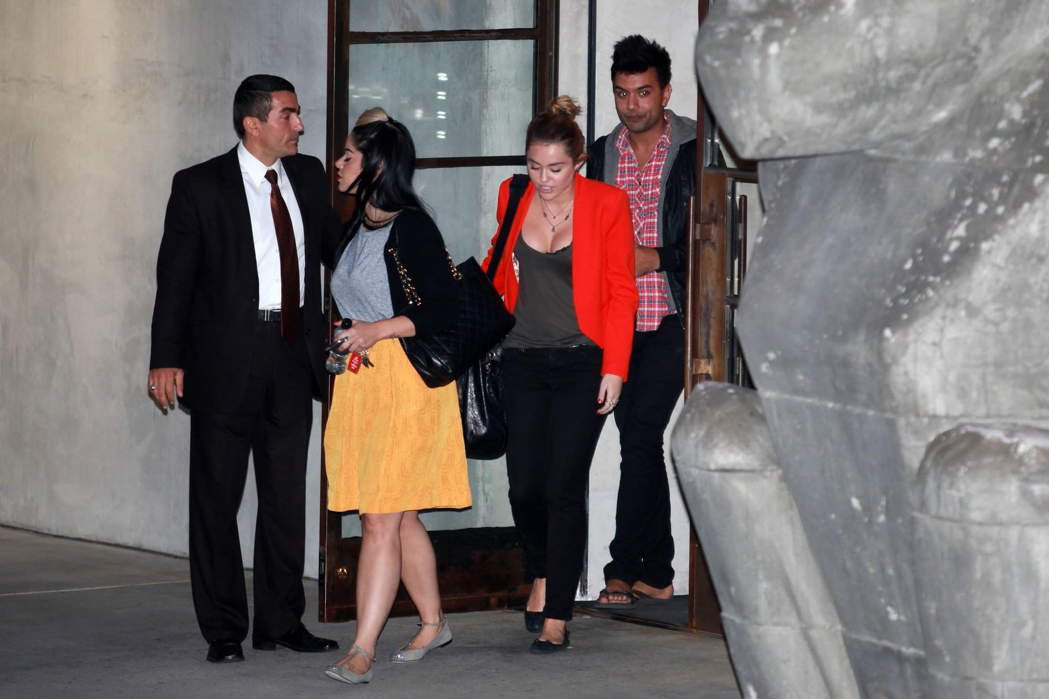 16P Miley Cyrus busty  bra peak out in Los Angeles