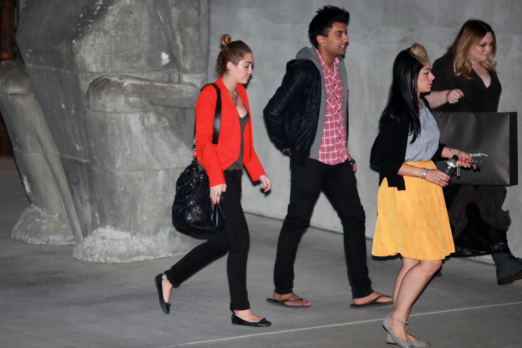 16P Miley Cyrus busty  bra peak out in Los Angeles