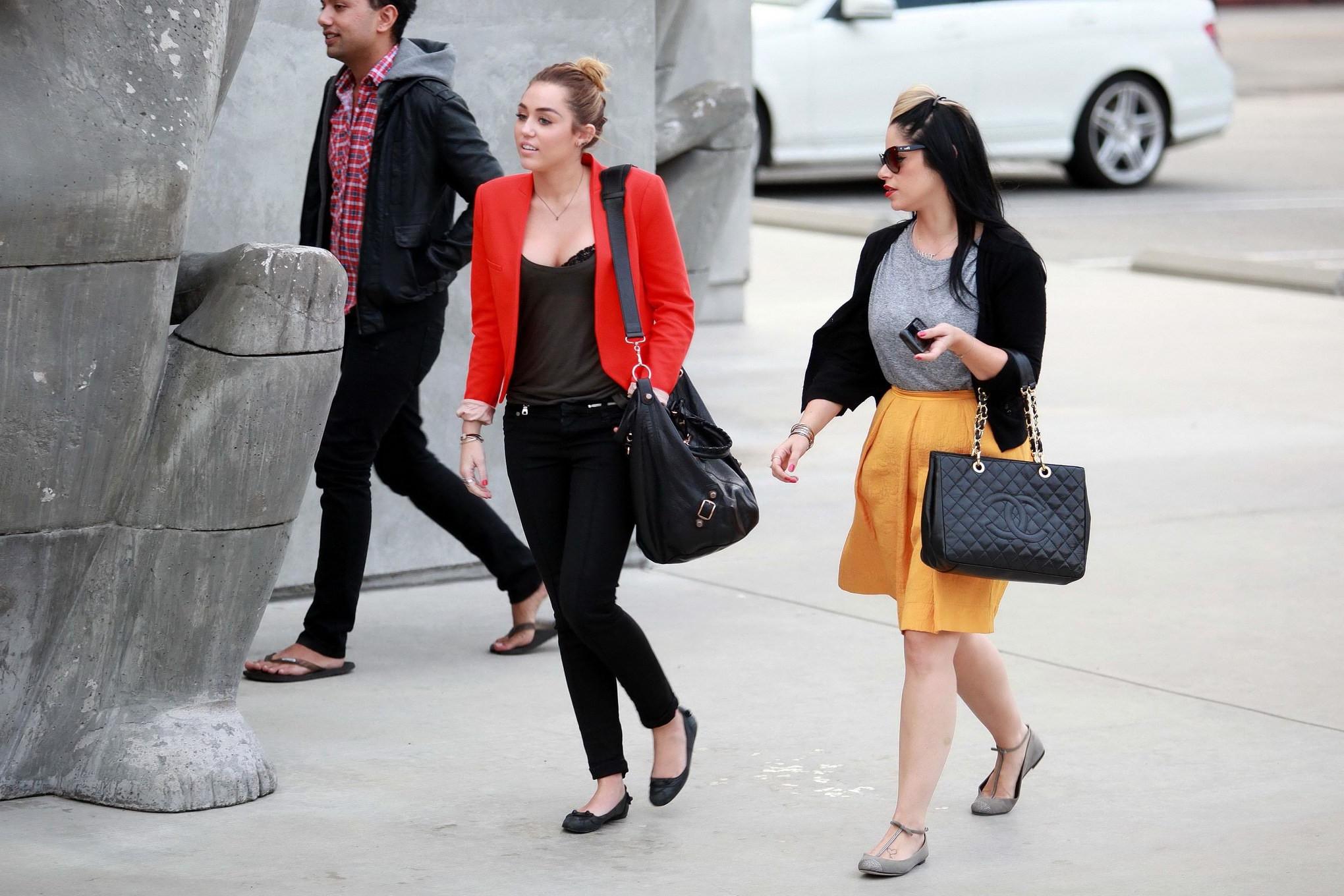 16P Miley Cyrus busty  bra peak out in Los Angeles