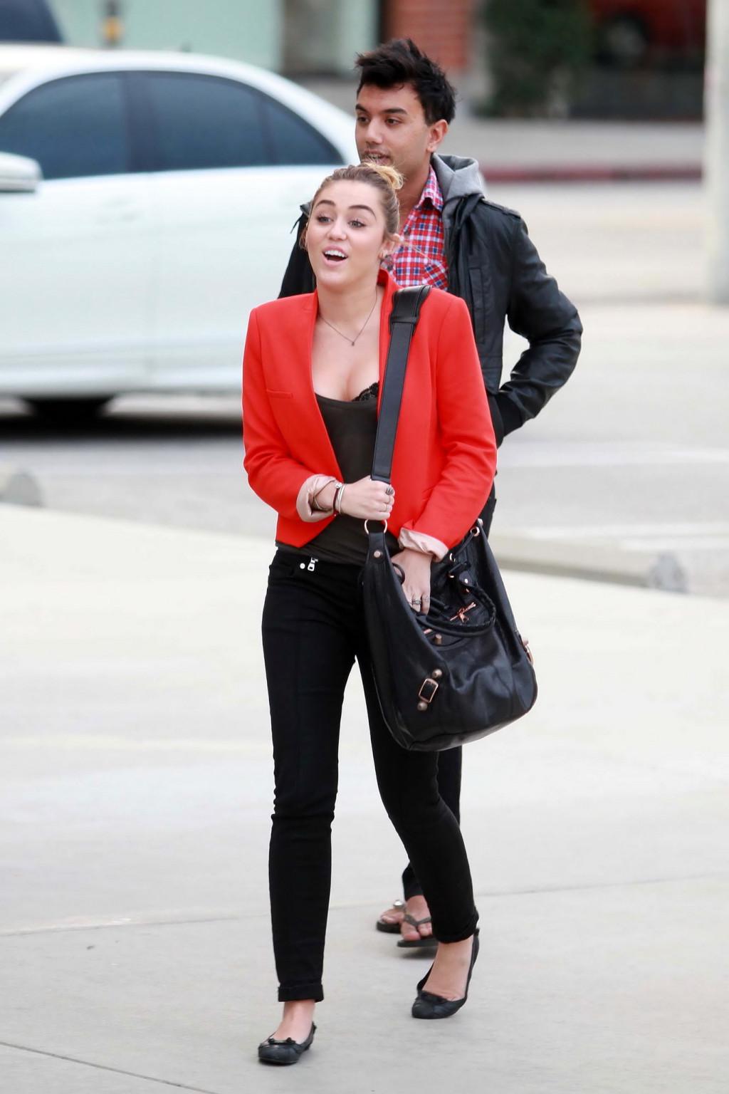 16P Miley Cyrus busty  bra peak out in Los Angeles