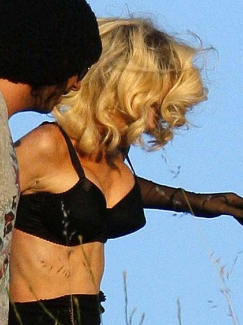 16P Lindsay Lohan exposing her sexy body and huge boobs just in bra