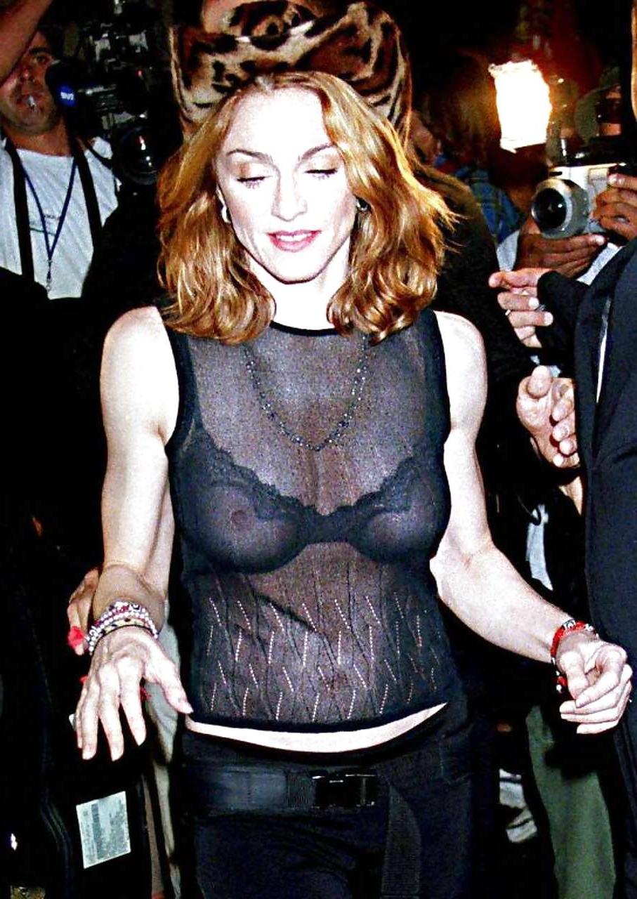 16P Madonna showing her tits in see thru bra and pubic hair on beach paparazzi pictu