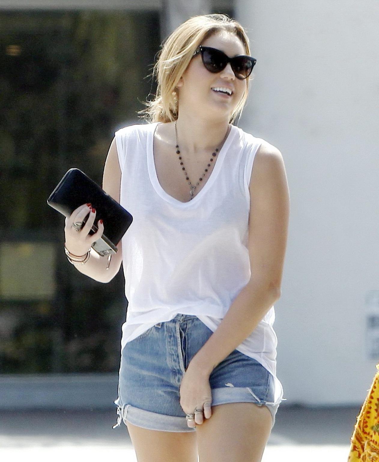 16P Miley Cyrus see-through to bra while shopping in LA
