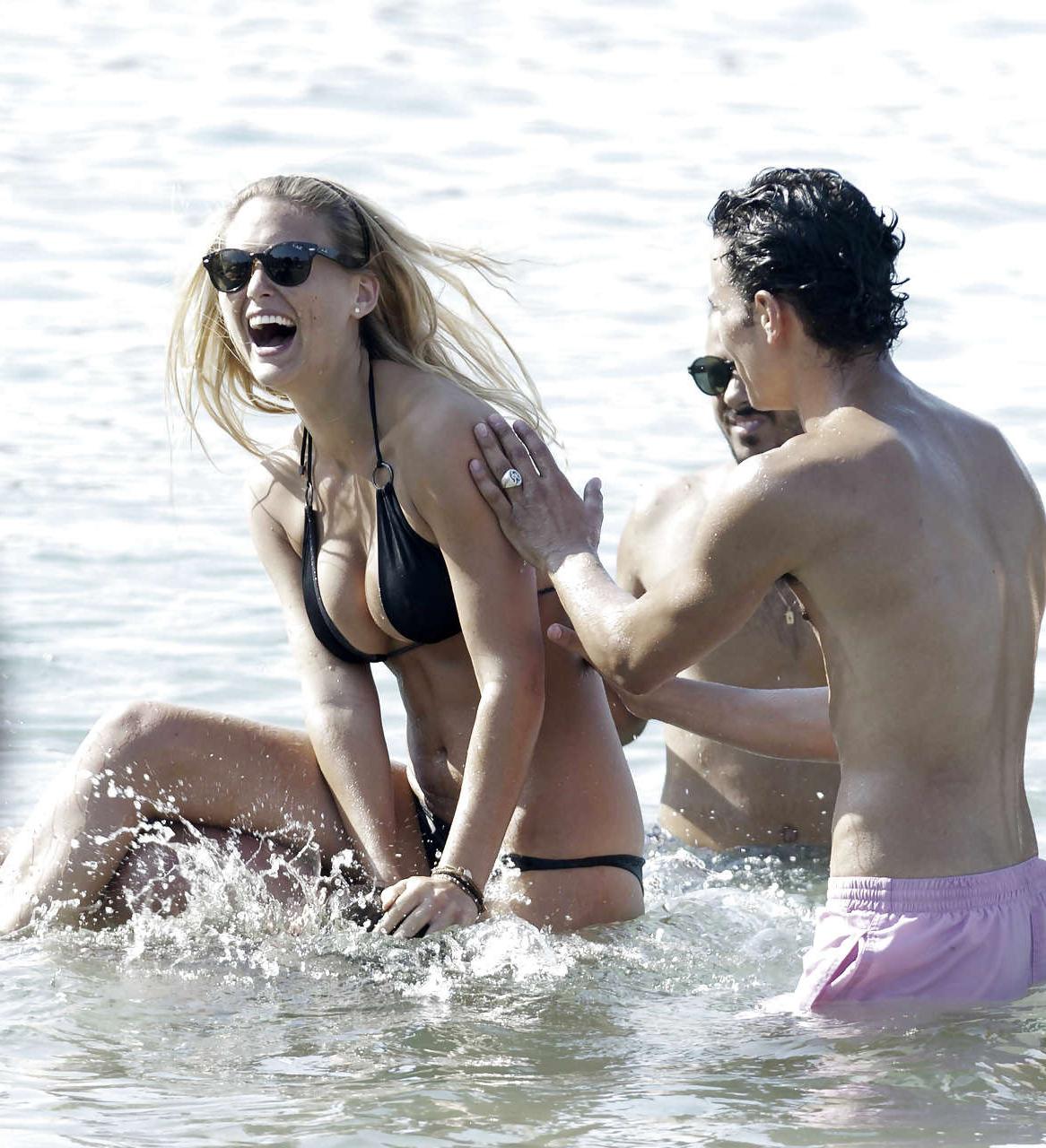 15P Bar Refaeli showing her fantastic ass in blue bikini and playing on beach