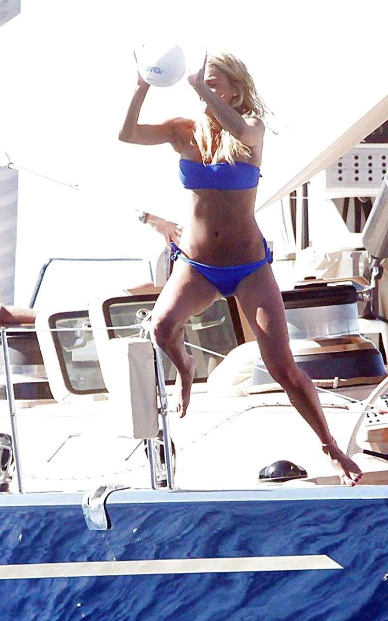 15P Bar Refaeli showing her fantastic ass in blue bikini and playing on beach