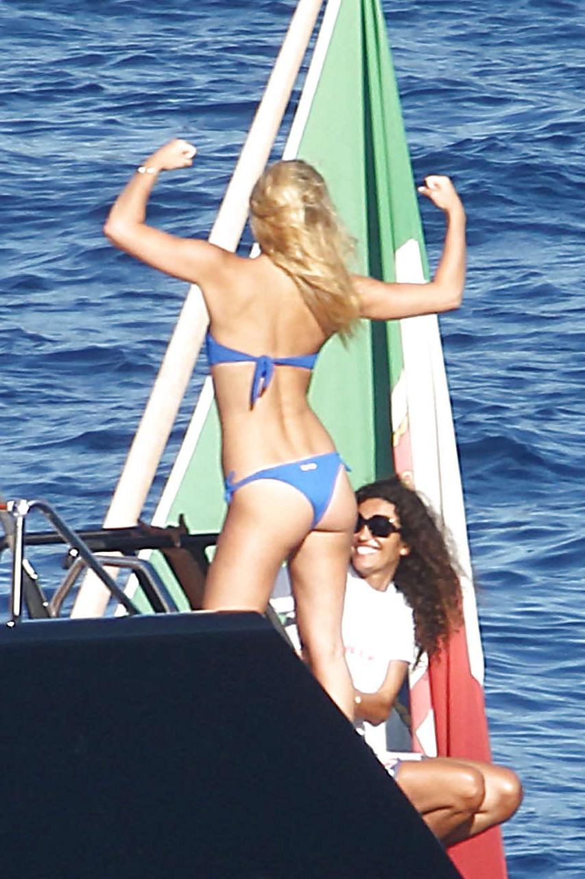 15P Bar Refaeli showing her fantastic ass in blue bikini and playing on beach