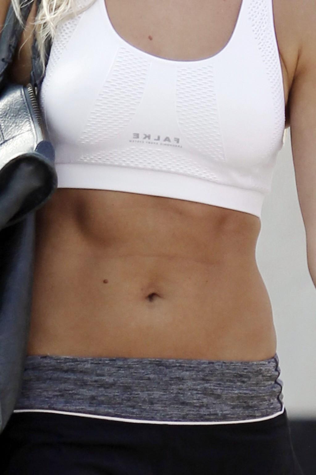 16P Ashley Tisdale shows off her abs wearing sports bra  shorts outside the gym in L