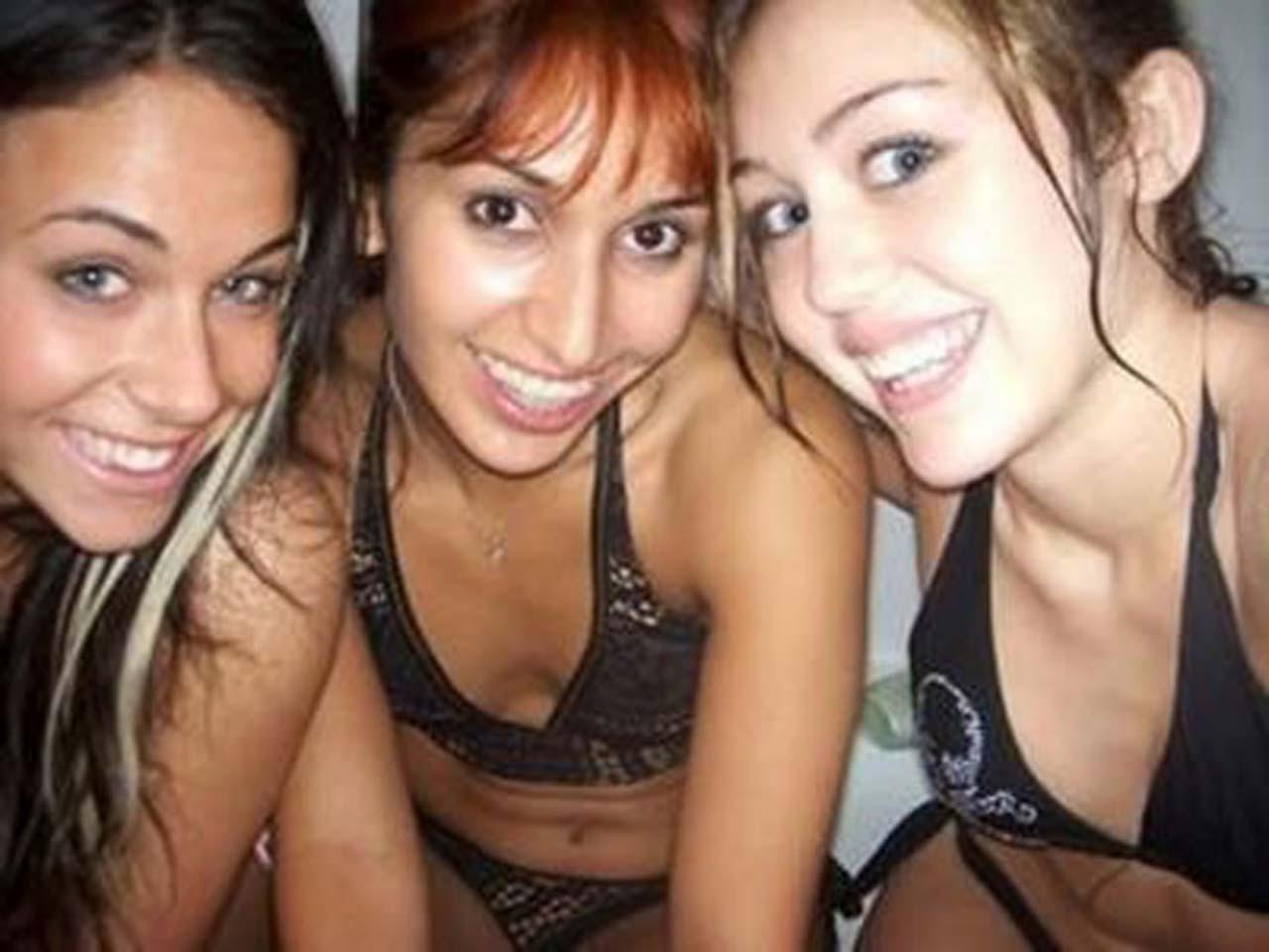 16P Miley Cyrus exposing her sexy body and nice tits in black bra