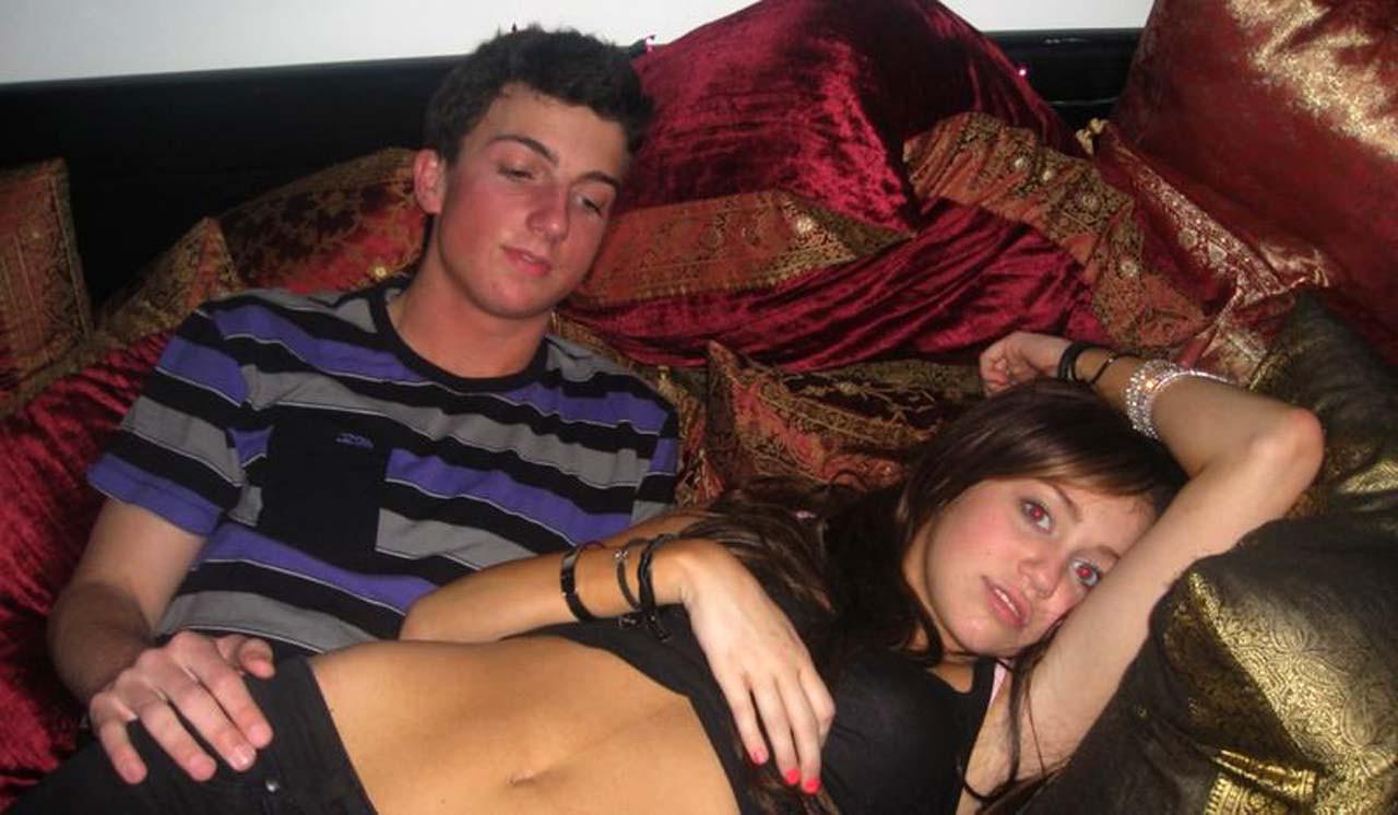 16P Miley Cyrus exposing her sexy body and nice tits in black bra