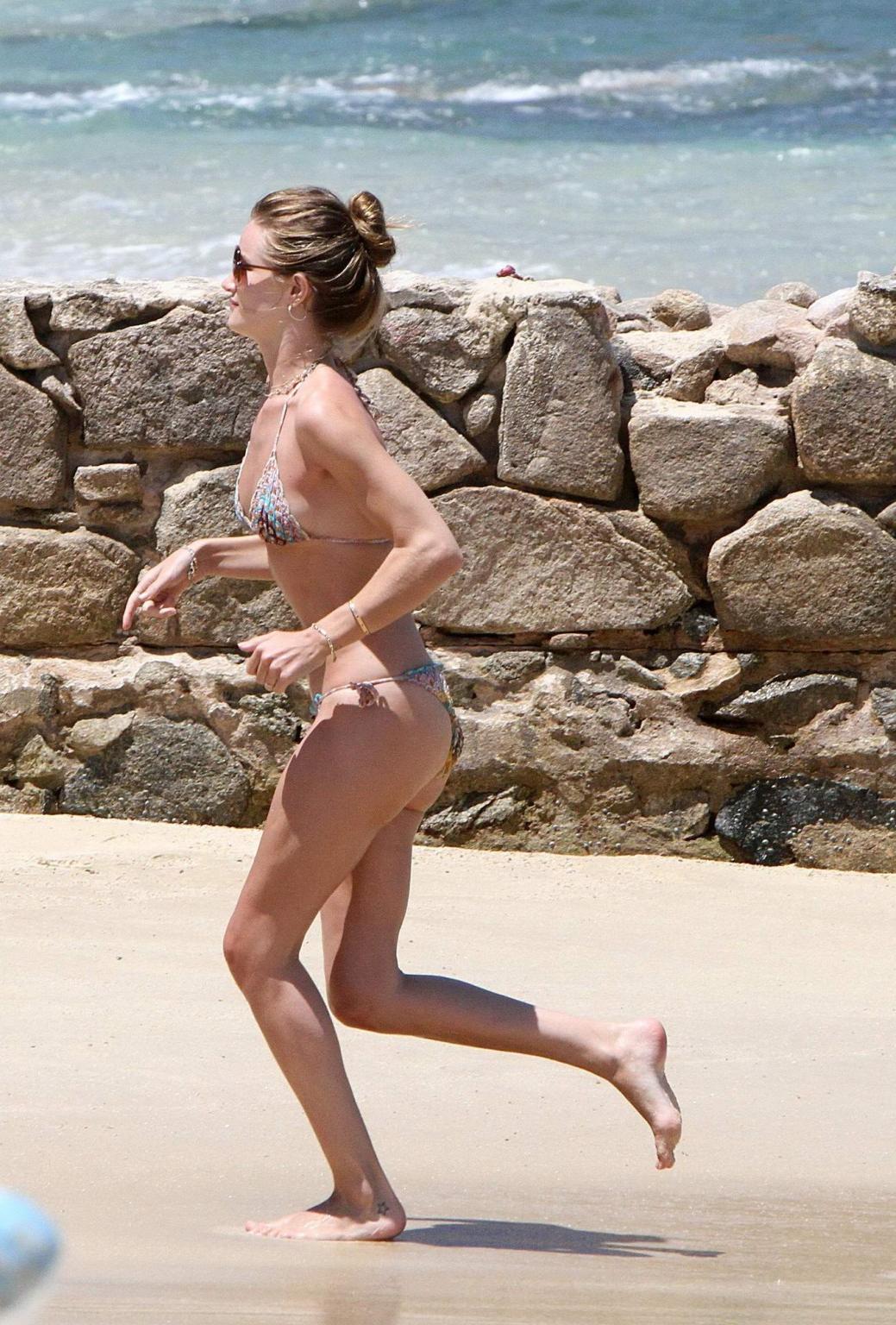 16P Rosie Huntington-Whiteley showing off her killer bikini body on a Mexican beach