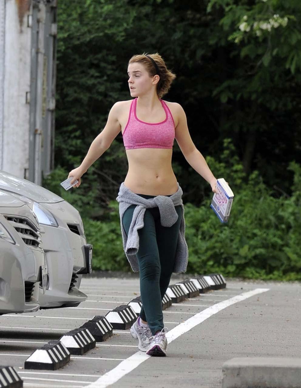 16P Emma Watson exposing sexy body and nice tits in sports bra on street