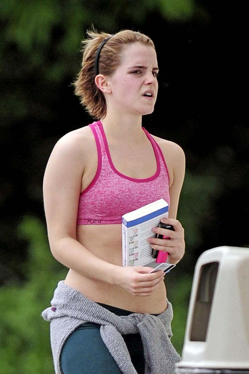 16P Emma Watson exposing sexy body and nice tits in sports bra on street