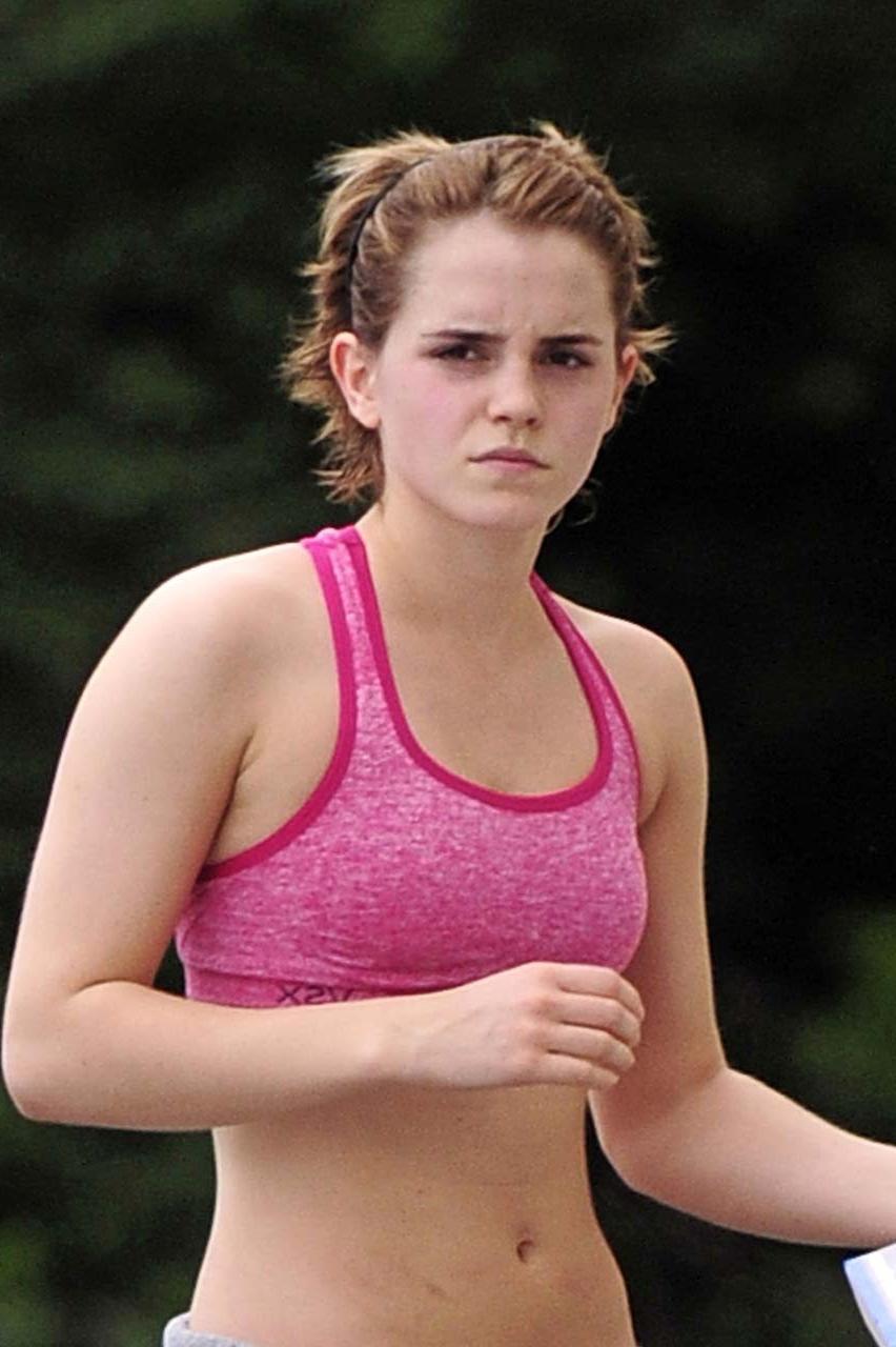 16P Emma Watson exposing sexy body and nice tits in sports bra on street