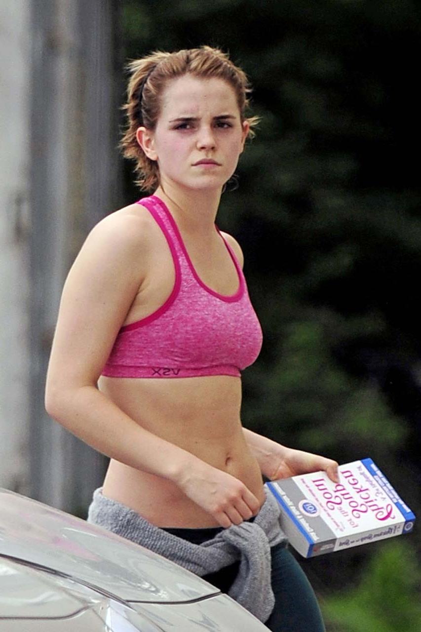 16P Emma Watson exposing sexy body and nice tits in sports bra on street