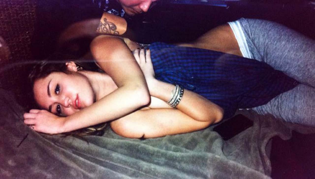 16P Miley Cyrus exposing sexy tits in bra on stage and geting new tattoo
