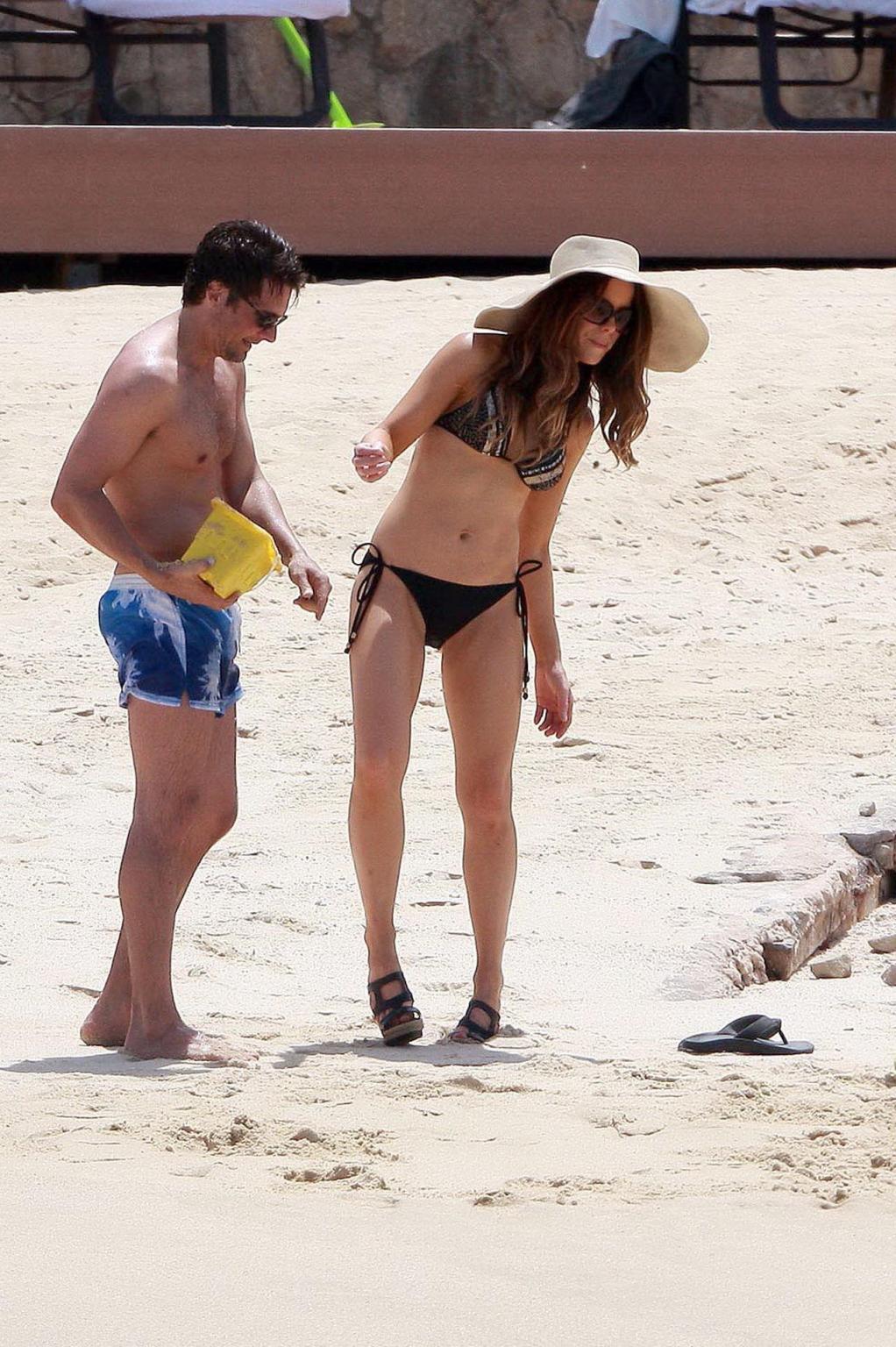 15P Kate Beckinsale wearing bikini  high heels on a Mexican beach