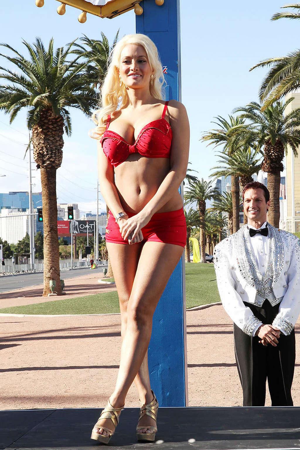 16P Holly Madison exposing her sexy body and huge tits in red bra
