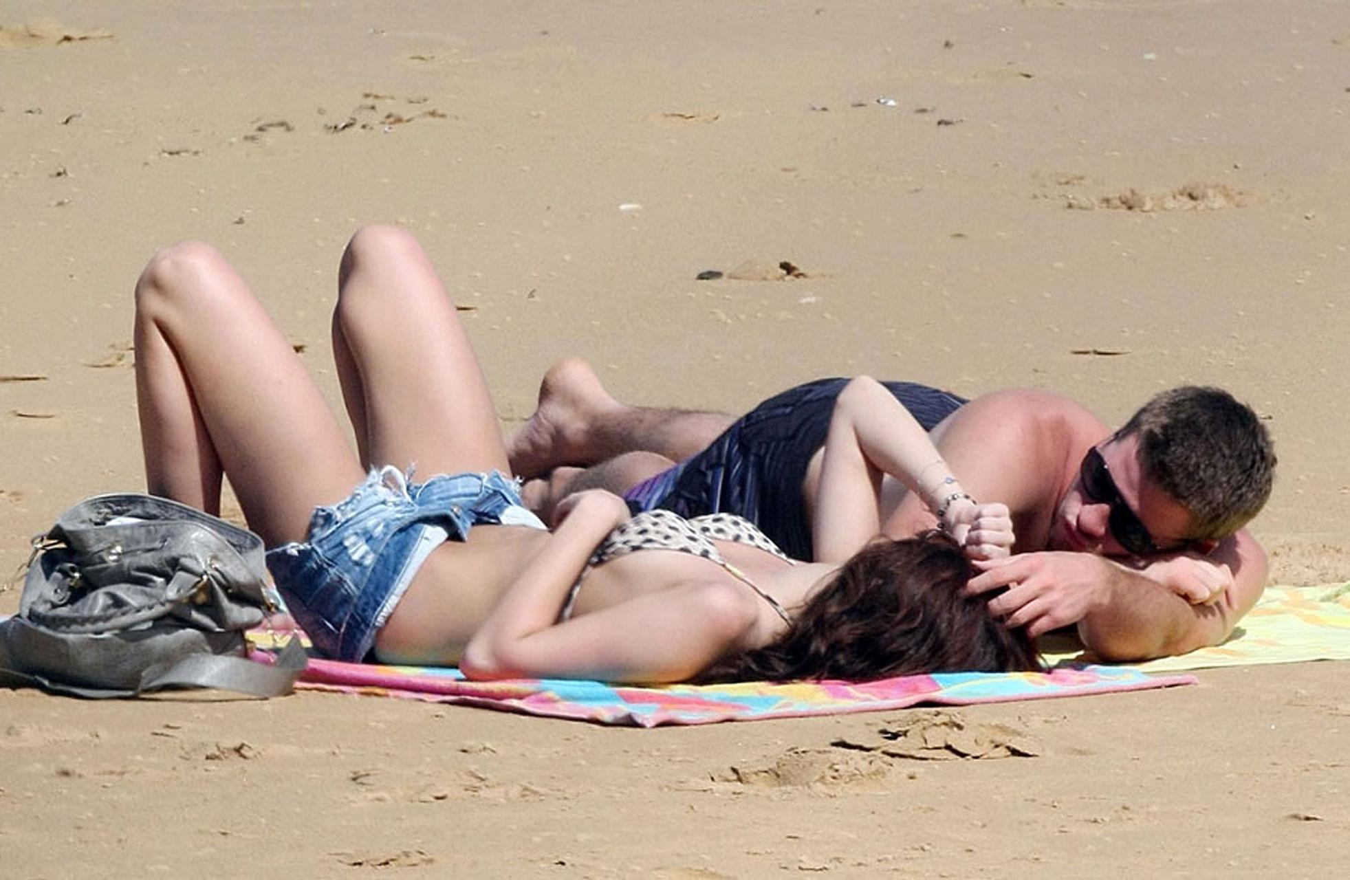 15P Miley Cyrus making love with her boyfriend on beach very sexy photos