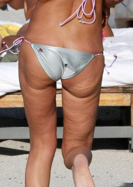 16P Tara Reid showing skinny body in skimpy bikini