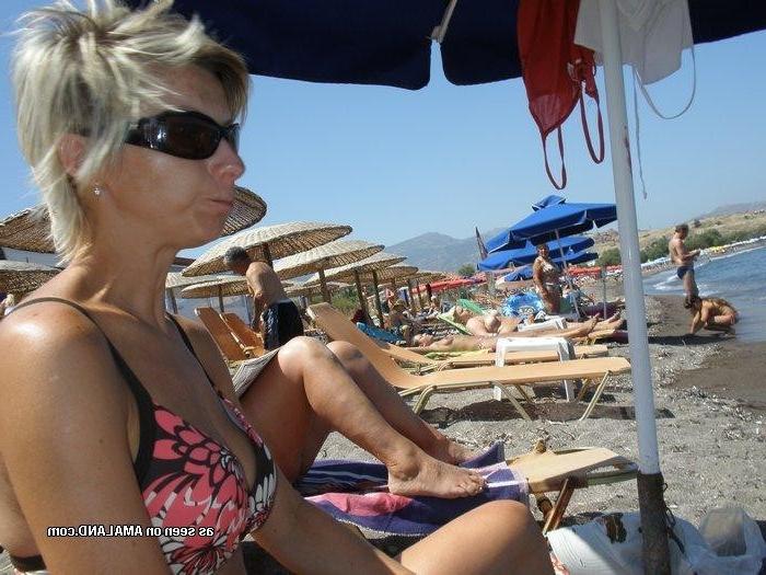 10P Gallery of a busty wife sunbathing topless while on vacation