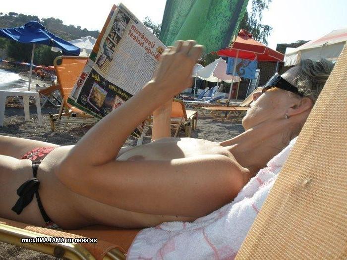 10P Gallery of a busty wife sunbathing topless while on vacation