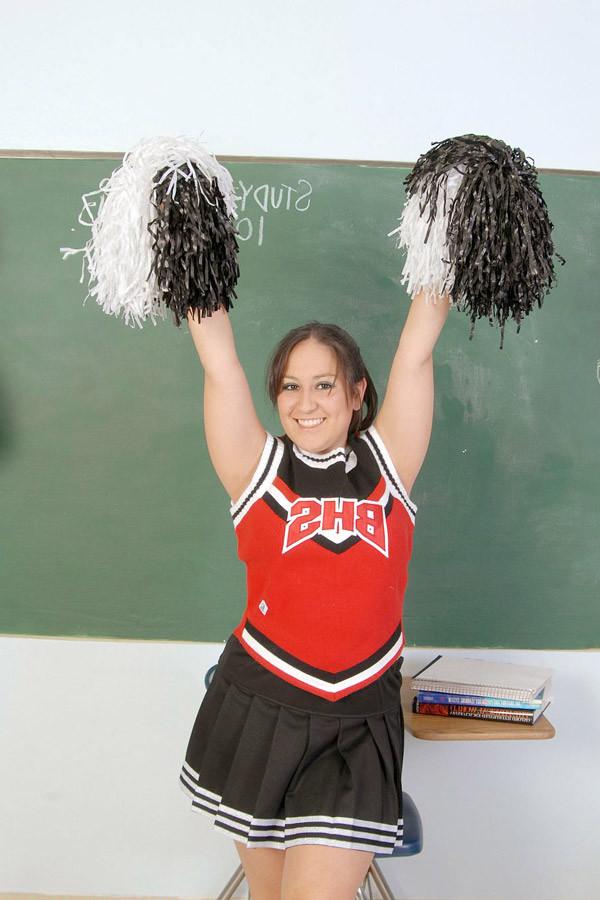 15P Chubby mexican cheerleader lifts her sirt in the class room