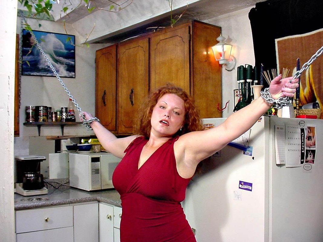 15P Stunning chained busty fat redhead