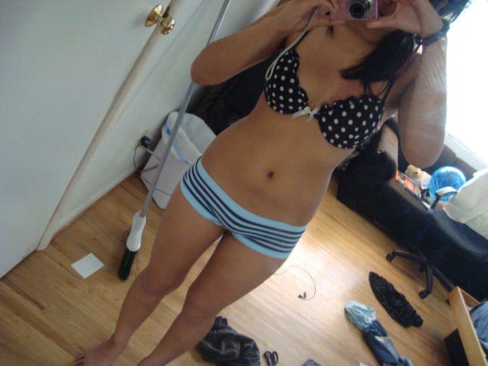 16P Photos of a busty GF playing with her pussy in her room