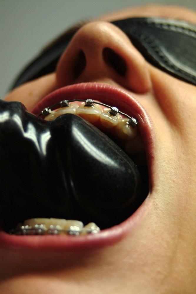 16P Dominatrix with a dildo plays with a pigtailed teen in braces