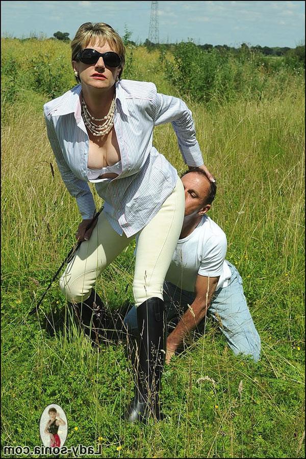 15P Sultry large breasted femdom milf posing outdoors