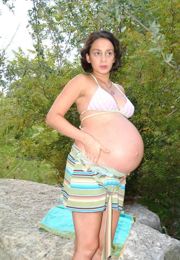 20P Pregnant cutie posing nude by river