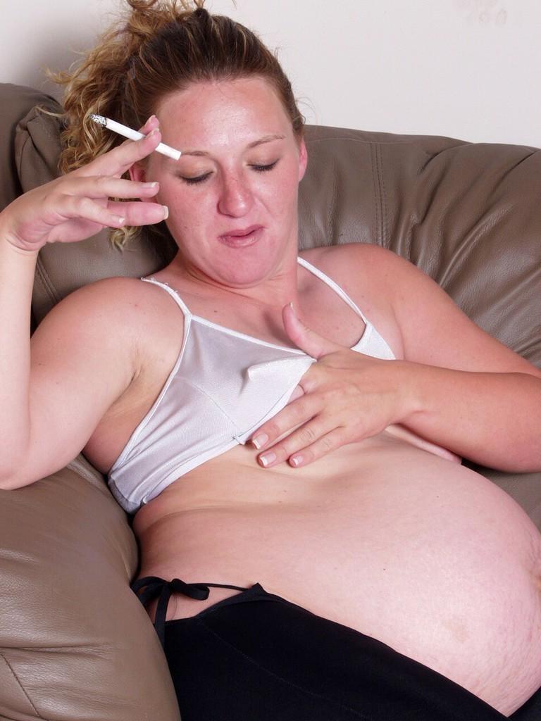 20P Smoking pregnant babe teasing and spreading her shaved twat