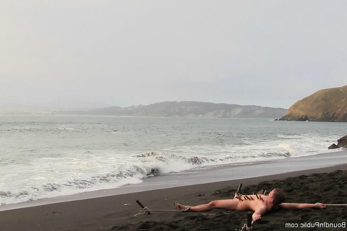 24P Gay being used and abused outdoor on a public beach.