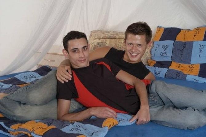 20P Two tanned smooth fellows sucking and fucking in a bed room