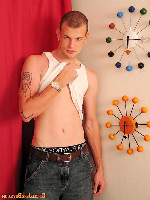 15P Sexy amateur gay stud undressing in a living room