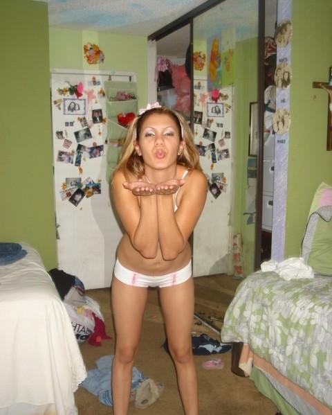 15P Busty blonde girl posing indoors and showing off her wet pussy