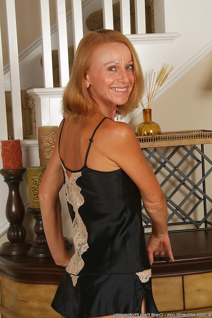 16P Tight redhead granny with big fake tits spreading pussy