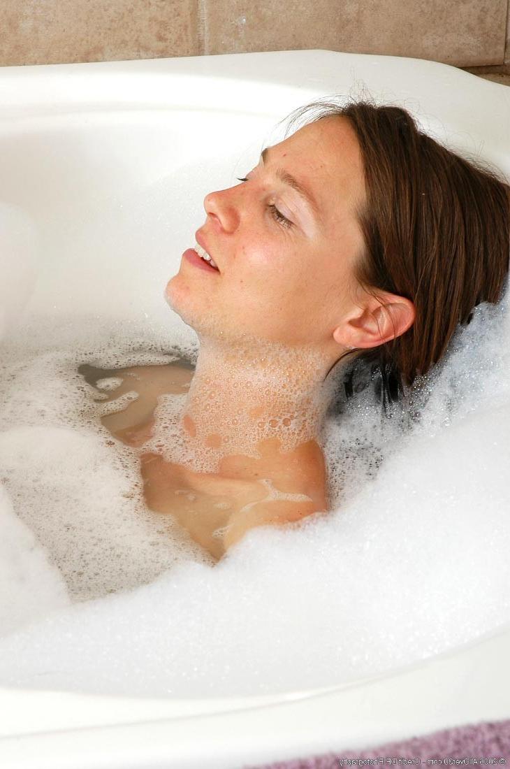 15P Extremely hairy mature with small tits taking a bath
