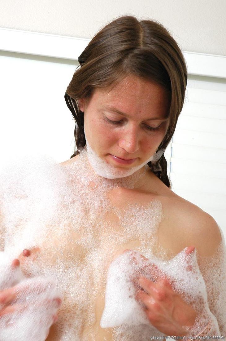 15P Extremely hairy mature with small tits taking a bath