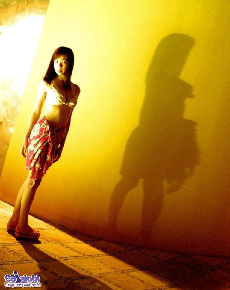 15P Busty and hairy Japanese girl posing and getting naked outdoor