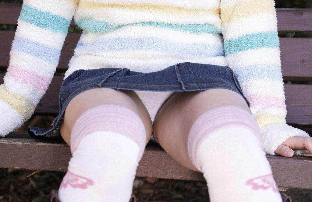 15P A Japanese girl takes her panties off outside flashes bald pussy