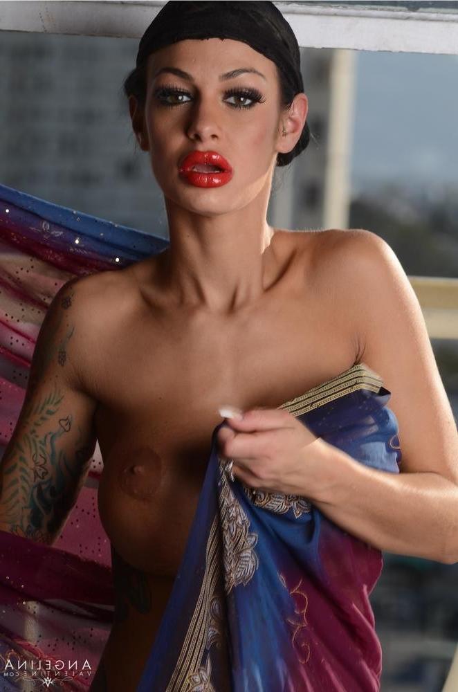 15P Angelina Valentine shows off her fake tits