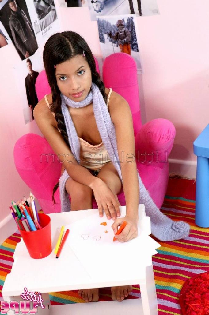 16P School girl little lupe with her hair braids doing homework