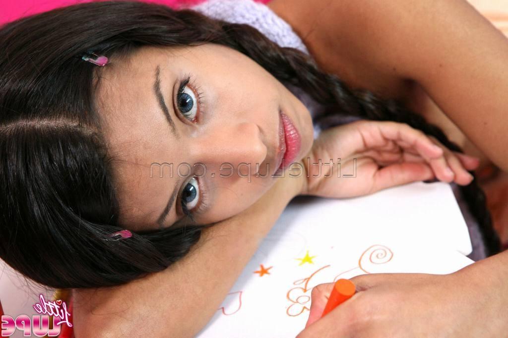 16P School girl little lupe with her hair braids doing homework