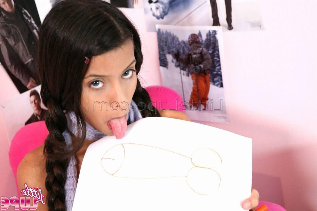 16P School girl little lupe with her hair braids doing homework