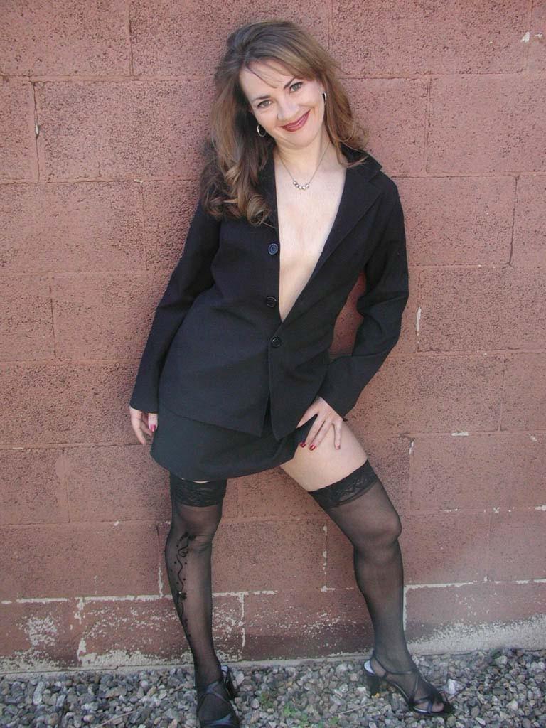 20P Gorgeous brunette milf in stockings loves strip teasing