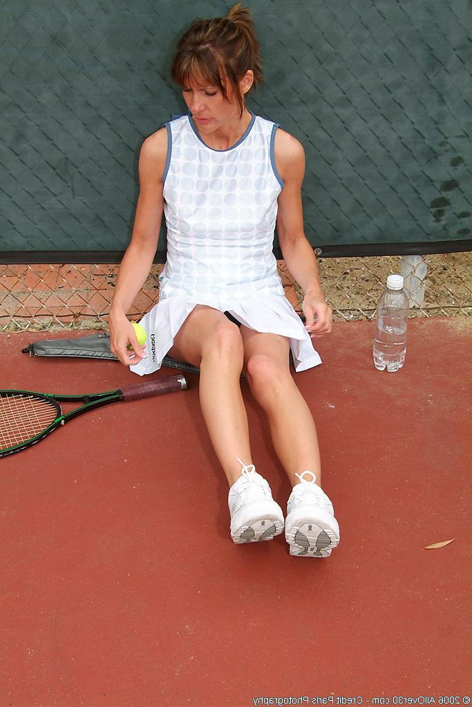 16P mature MILF brunette tennis player gets naked on court