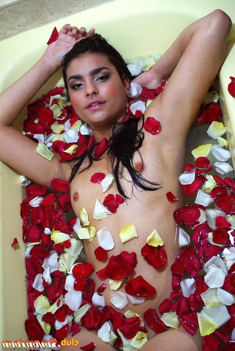 15P Cute naked teenage hottie taking a sexy flower petal bath