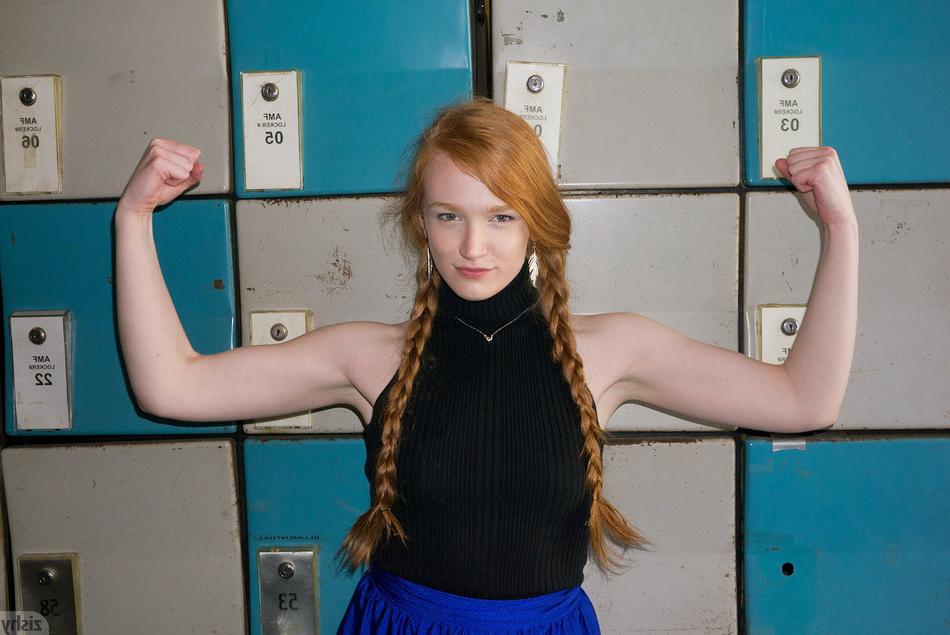 10P Red hair teen Bree Abernathy has her hair in braided pigtails while she bowls in
