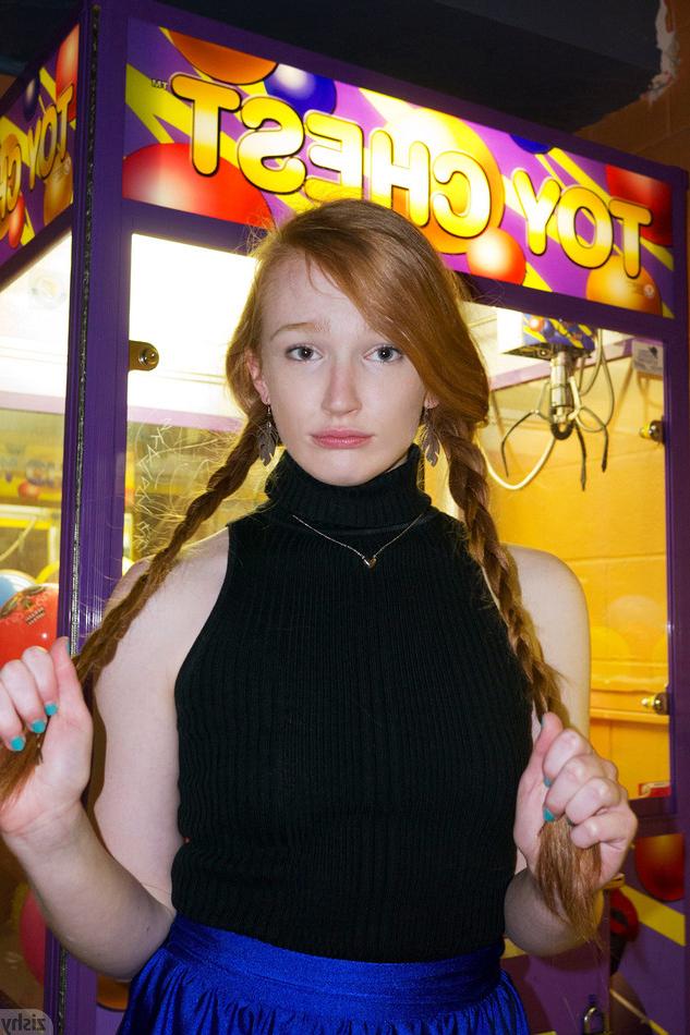 10P Red hair teen Bree Abernathy has her hair in braided pigtails while she bowls in